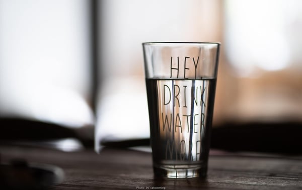 Hey, drink more water! This is one of the many examples of a new year's resolution that is realistic for people with ADHD.