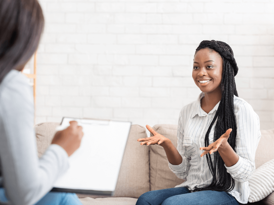 A Black woman with ADHD speaks with her therapist about an ADHD diagnosis