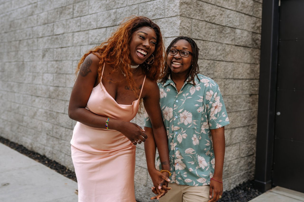 happy couple holding hands and laughing