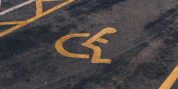 Handicap symbol on asphalt. Photo by Jakub Pabis.