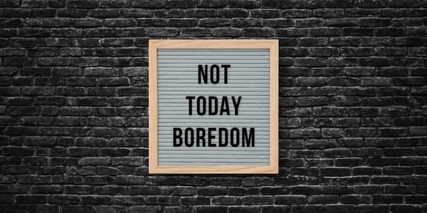 dark brick wall with a letter board on it. It says, "not today boredom"