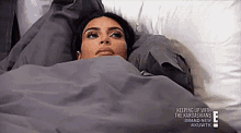 GIF: kim kardashian lying under covers and staring at the ceiling