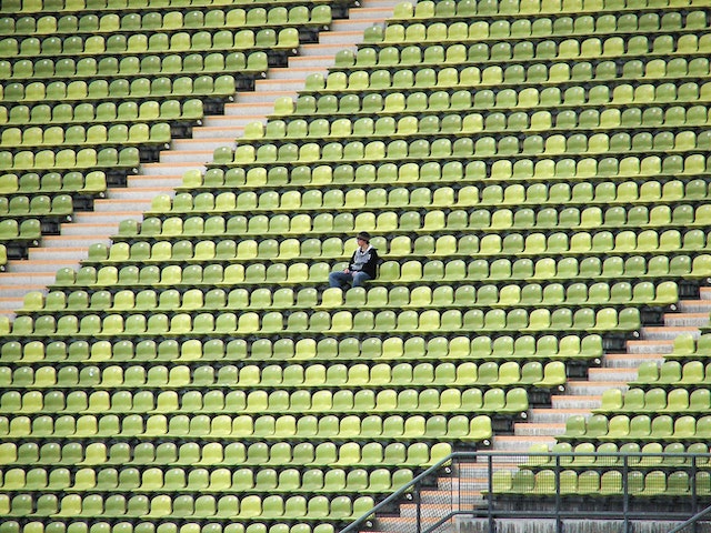 An empty stadium except for one lone person