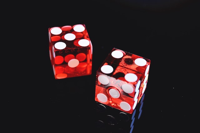 A pair of red dice to symbolize a gambling addiction, common in ADHD; something that may be a reason for a dopamine detox