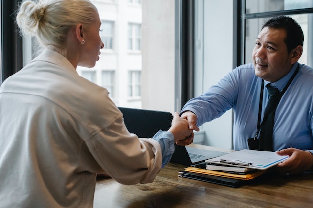 a doctor meeting with a patient in his office to discuss treatment options for adhd and low dopamine.