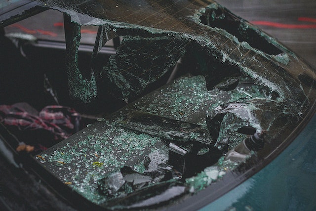 A broken windshield from a car crash that led to a traumatic brain injury or tbi