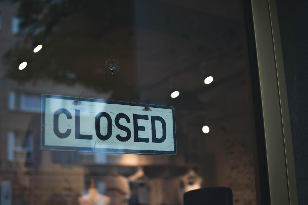 Closed sign on a shop door