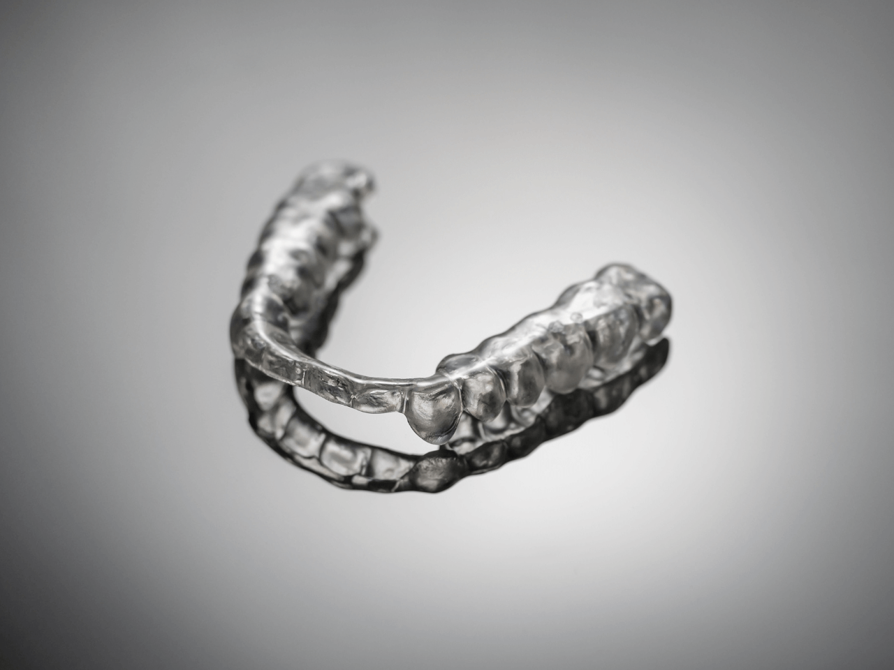 A photo of a clear mouth guard to wear at night for nocturnal bruxism.