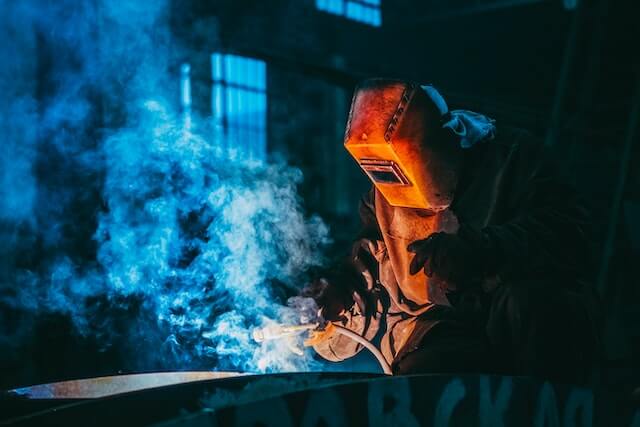 A person with ADHD works on a welding project