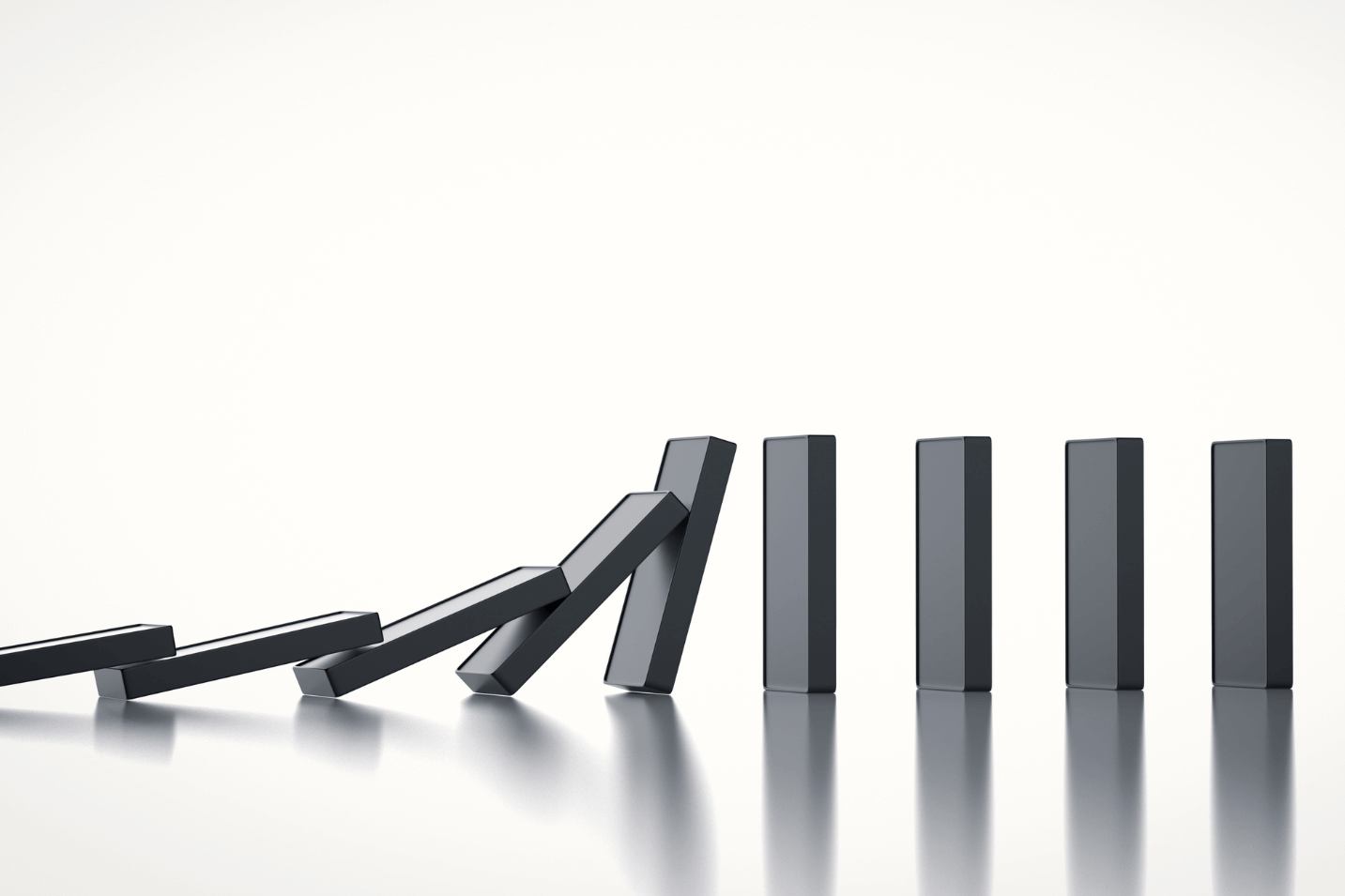 Blank black dominoes lined up on a