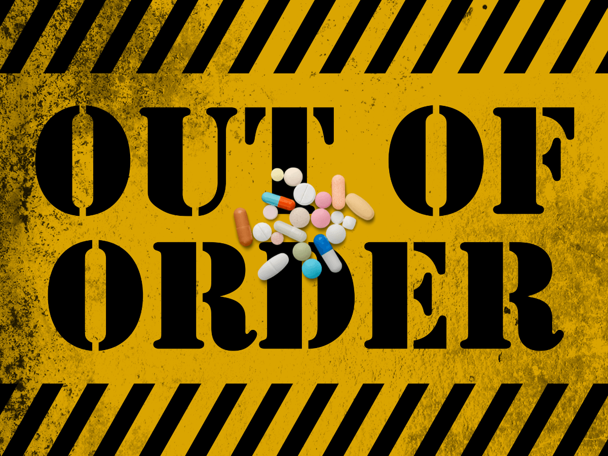 A yellow our of order sign with generic adhd medication on top of it.