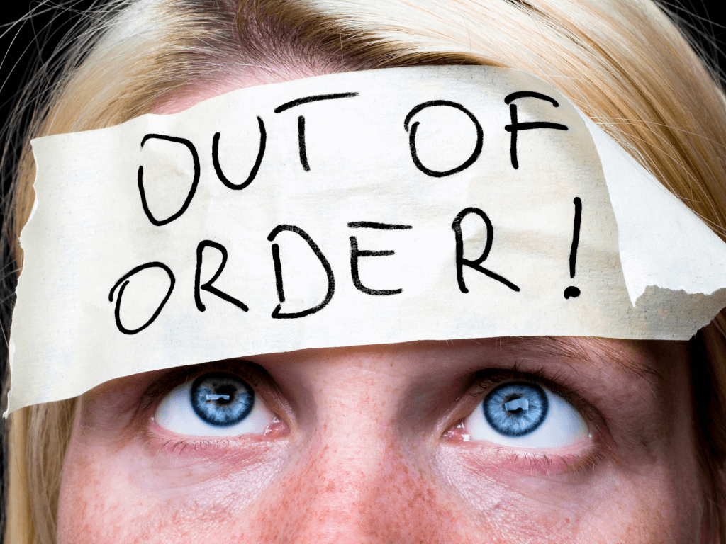ADHD brain unmotivated image - tape on head that reads: out of order