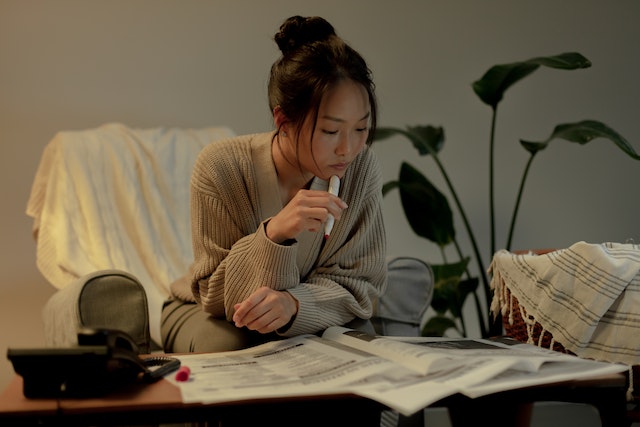 woman reading a newspaper